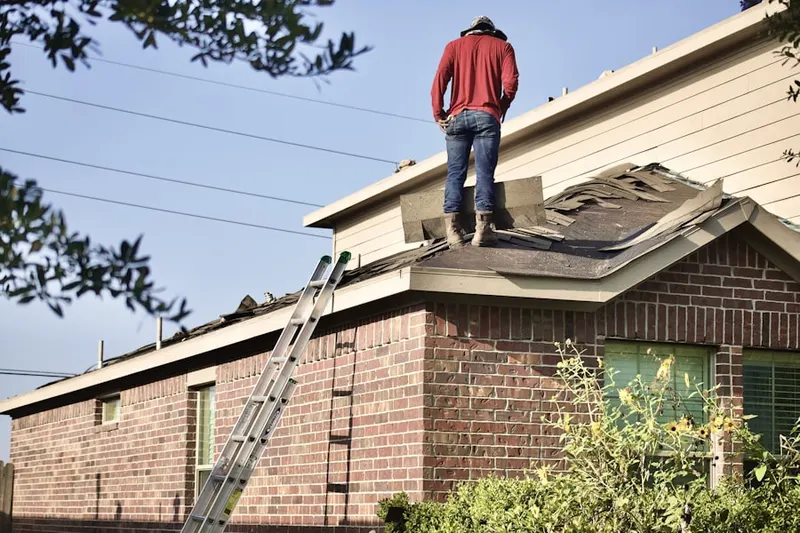 Professional roofer working on a residential roof in Seneca Upland